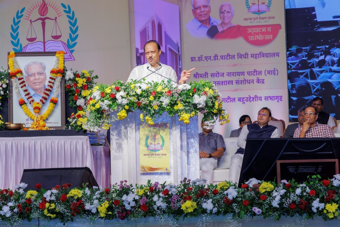 Home ajit-powar-on-podium-beside-ndp-photo (Medium)